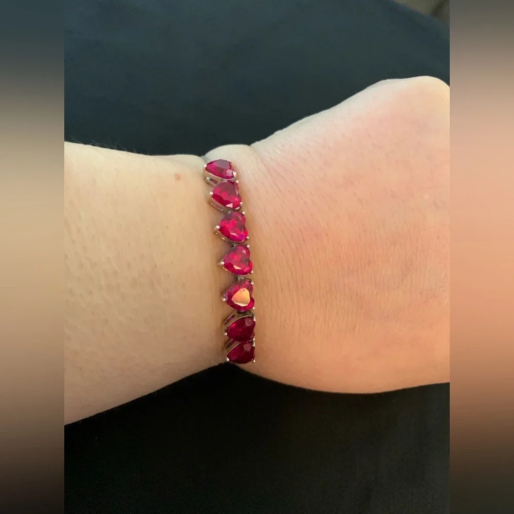 Rhodium over sterling silver lab ruby heart bolo bracelet